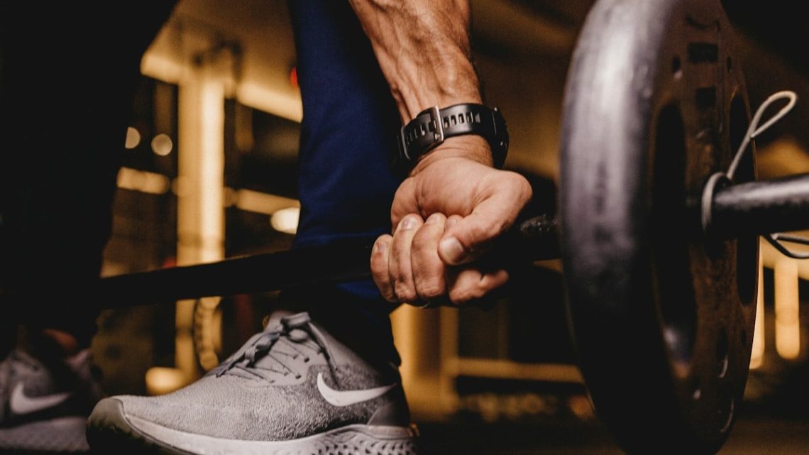 person about to lift barbell